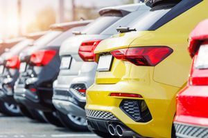A fleet of modern multi-coloured SUVs at a dealership, illustrating the fast-changing French car market.