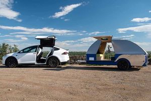 Electric car with parked trailer