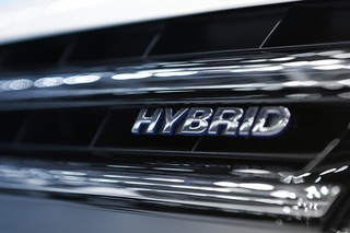 Hybrid logo on a modern car, a symbol of electrification
